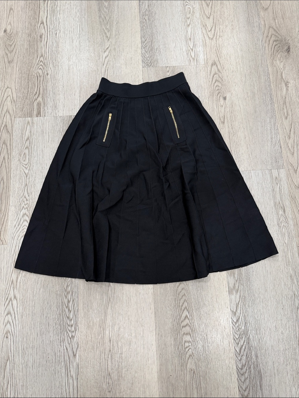 Black A-Line Mid-Length Skirt with Gold Zipper Accent